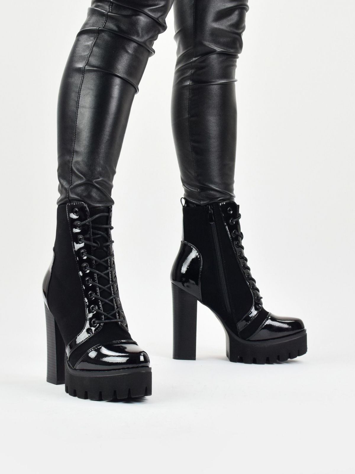 High heeled lace up platform boots in black