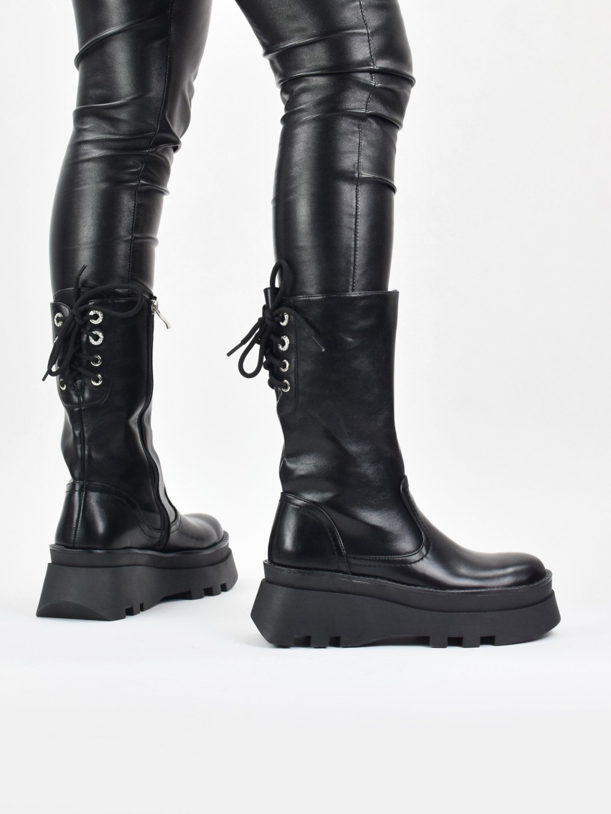 Platform mid calf boots with back lace up detail in black