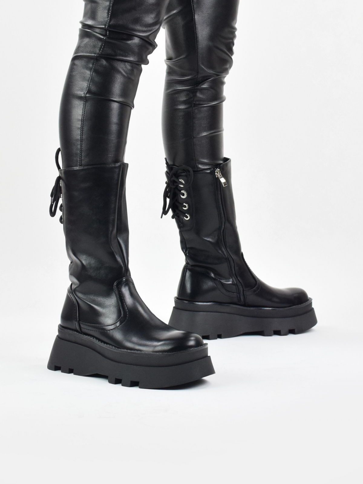 Platform mid calf boots with back lace up detail in black