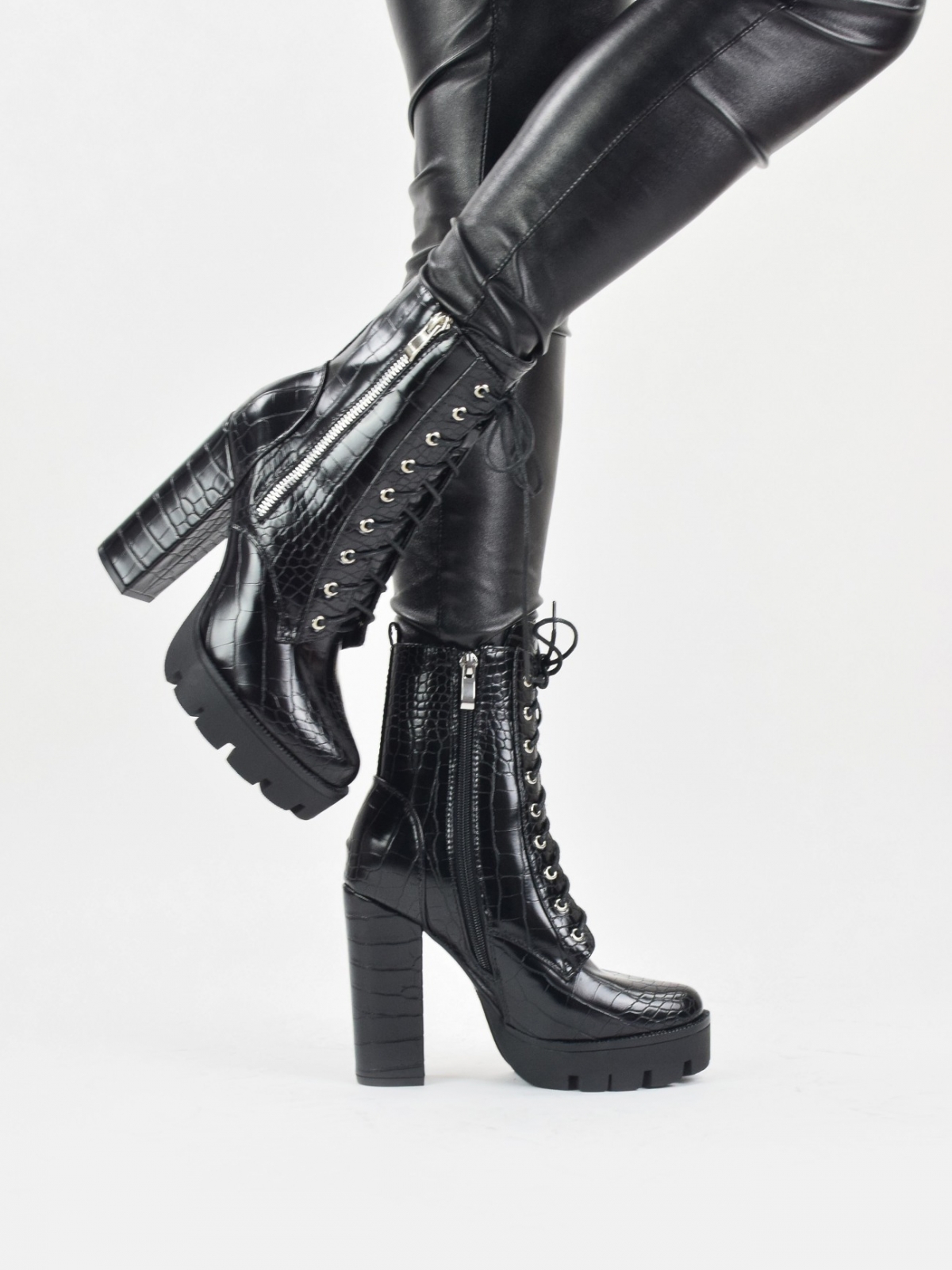 High heeled lace up platform boots with outside zip detail in black snake patent