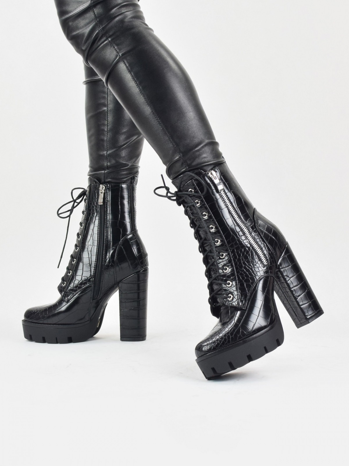 High heeled lace up platform boots with outside zip detail in black snake patent