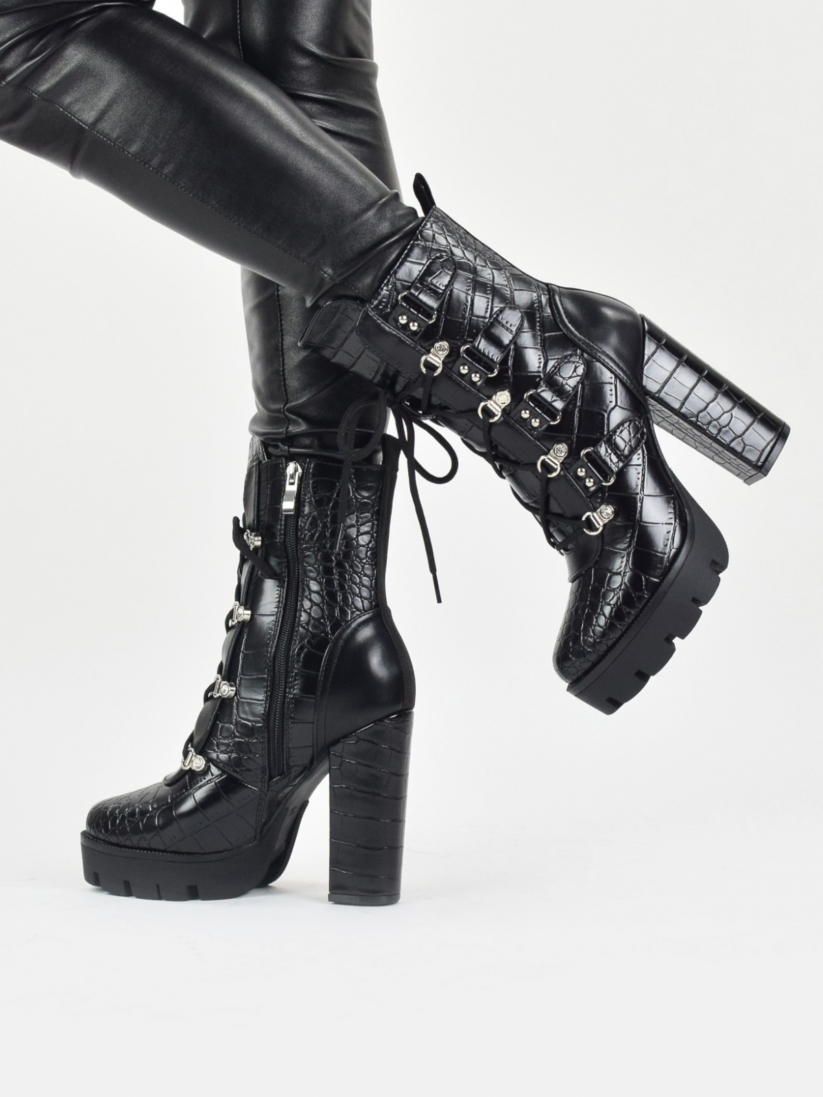 High heeled lace up platform boots in black snake patent