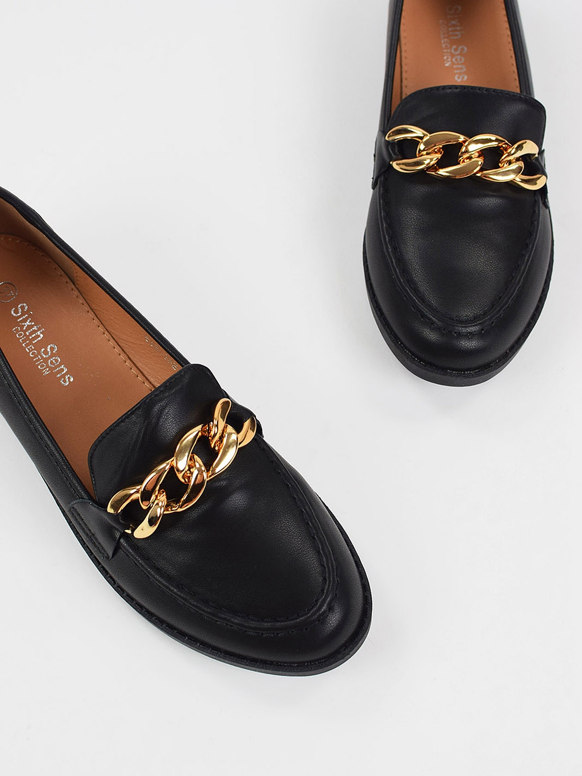 Gold color chain loafers in black