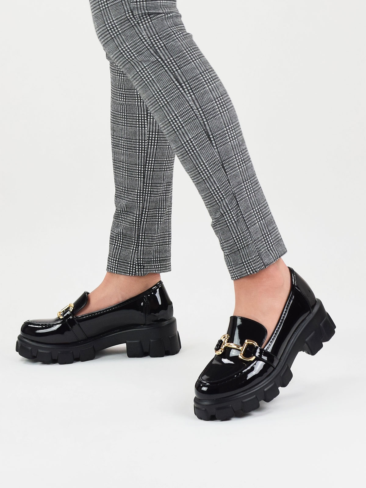 Chunky loafers with gold trim in black patent