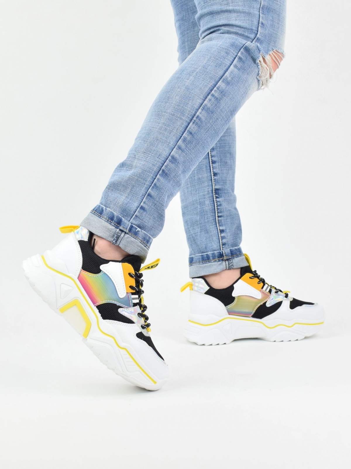 Stylish sneakers with holographic details in yellow