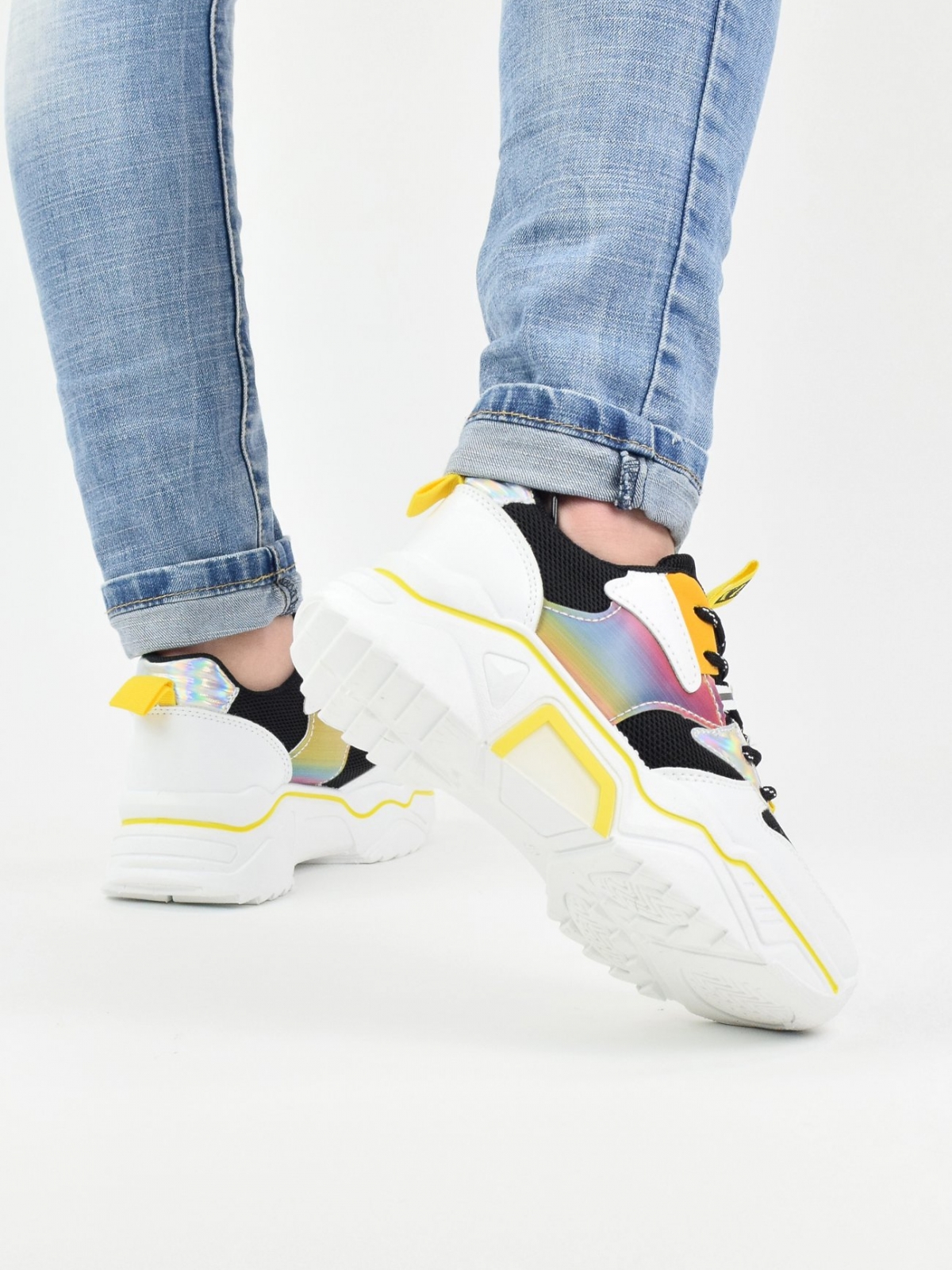 Stylish sneakers with holographic details in yellow