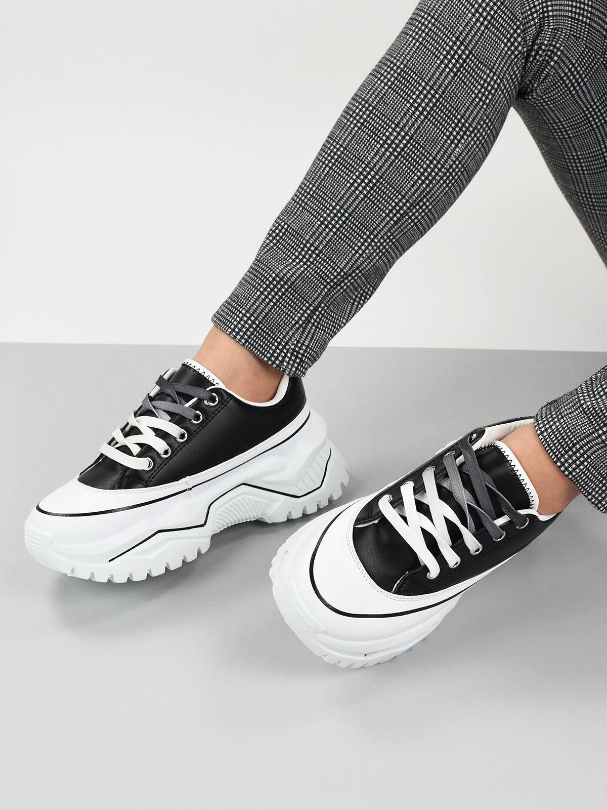Lace up chunky sole trainers in black