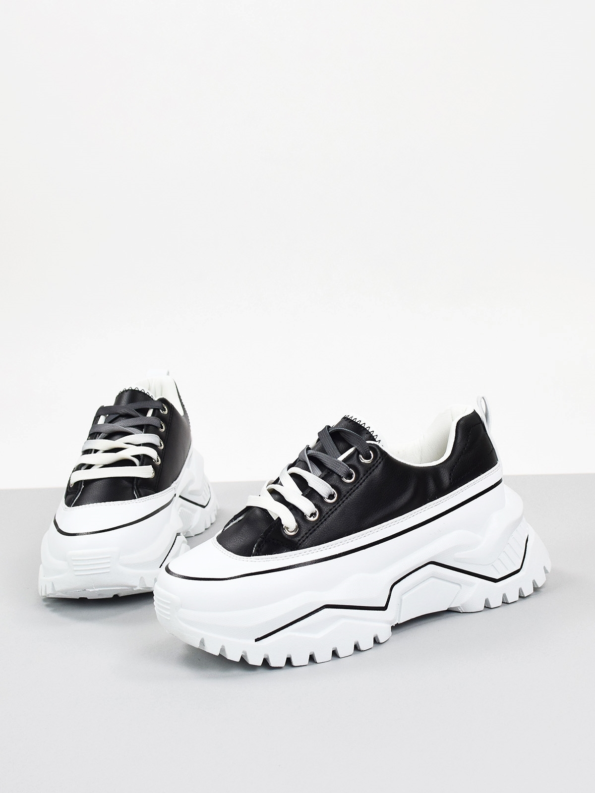 Lace up chunky sole trainers in black