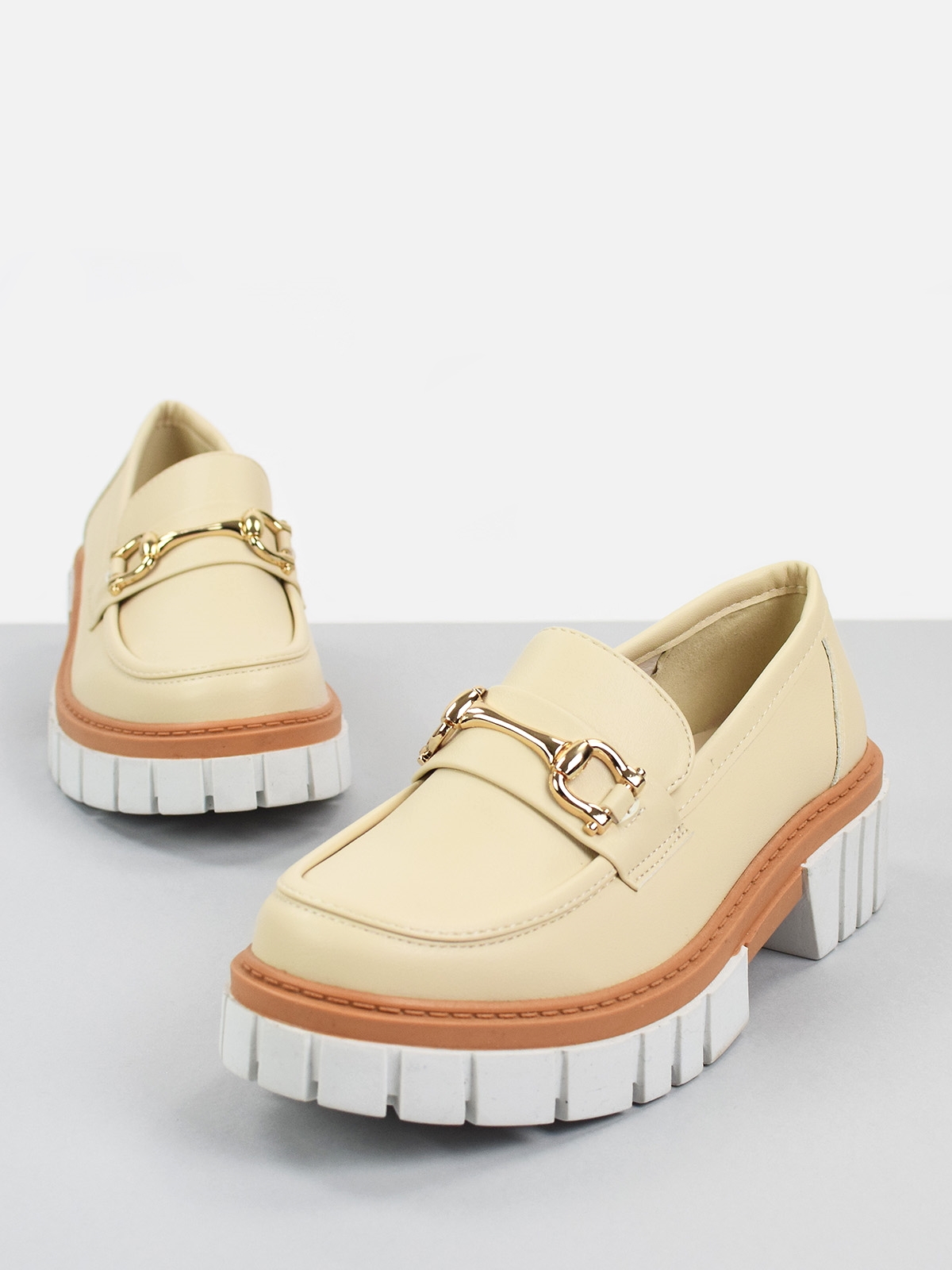 Chunky loafers with front gold trim in neutral color