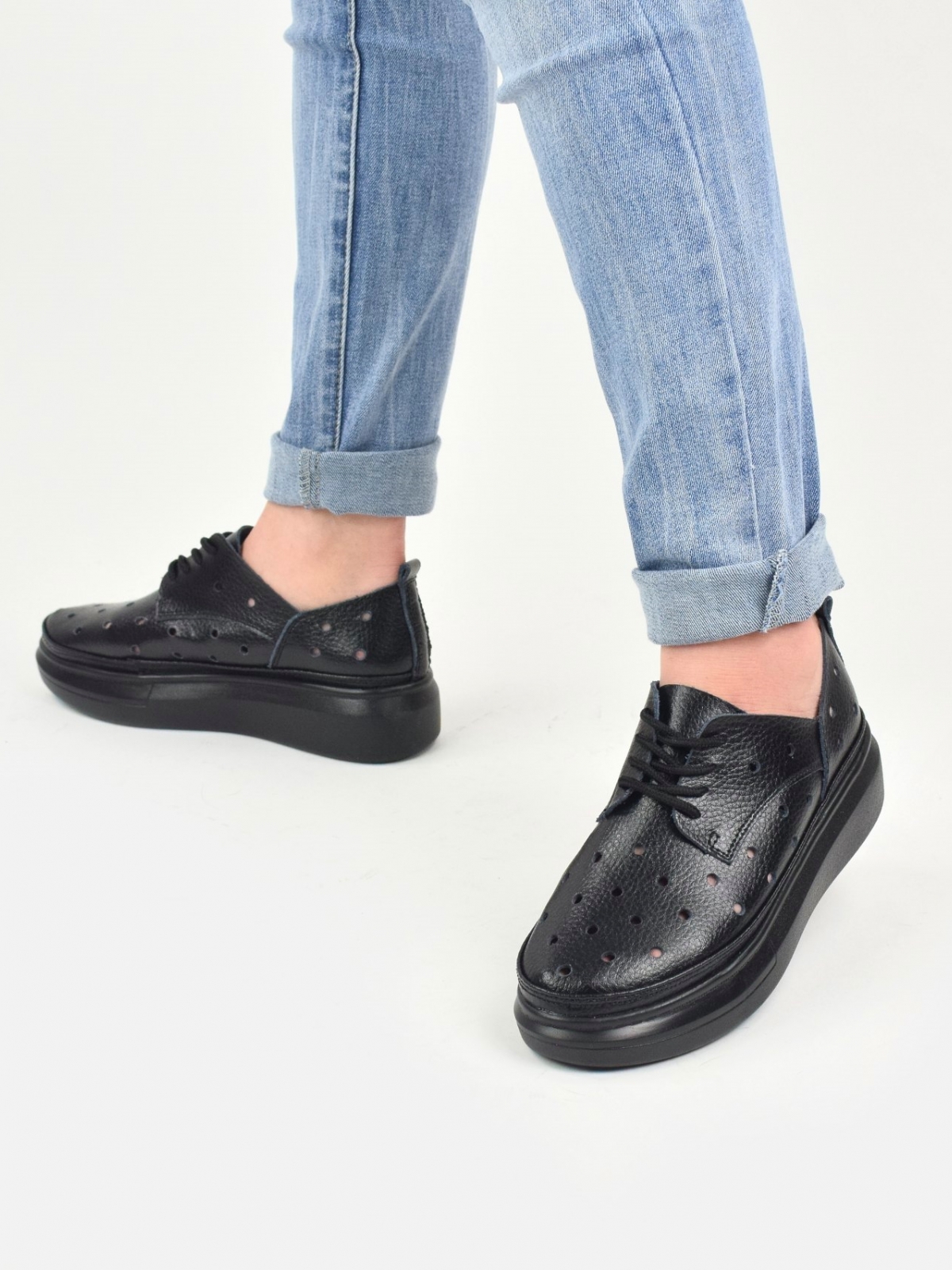 Genuine leather holed flat shoes in black
