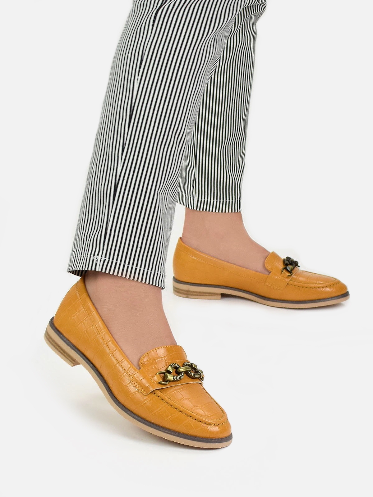 Loafers with gold tone detail in yellow