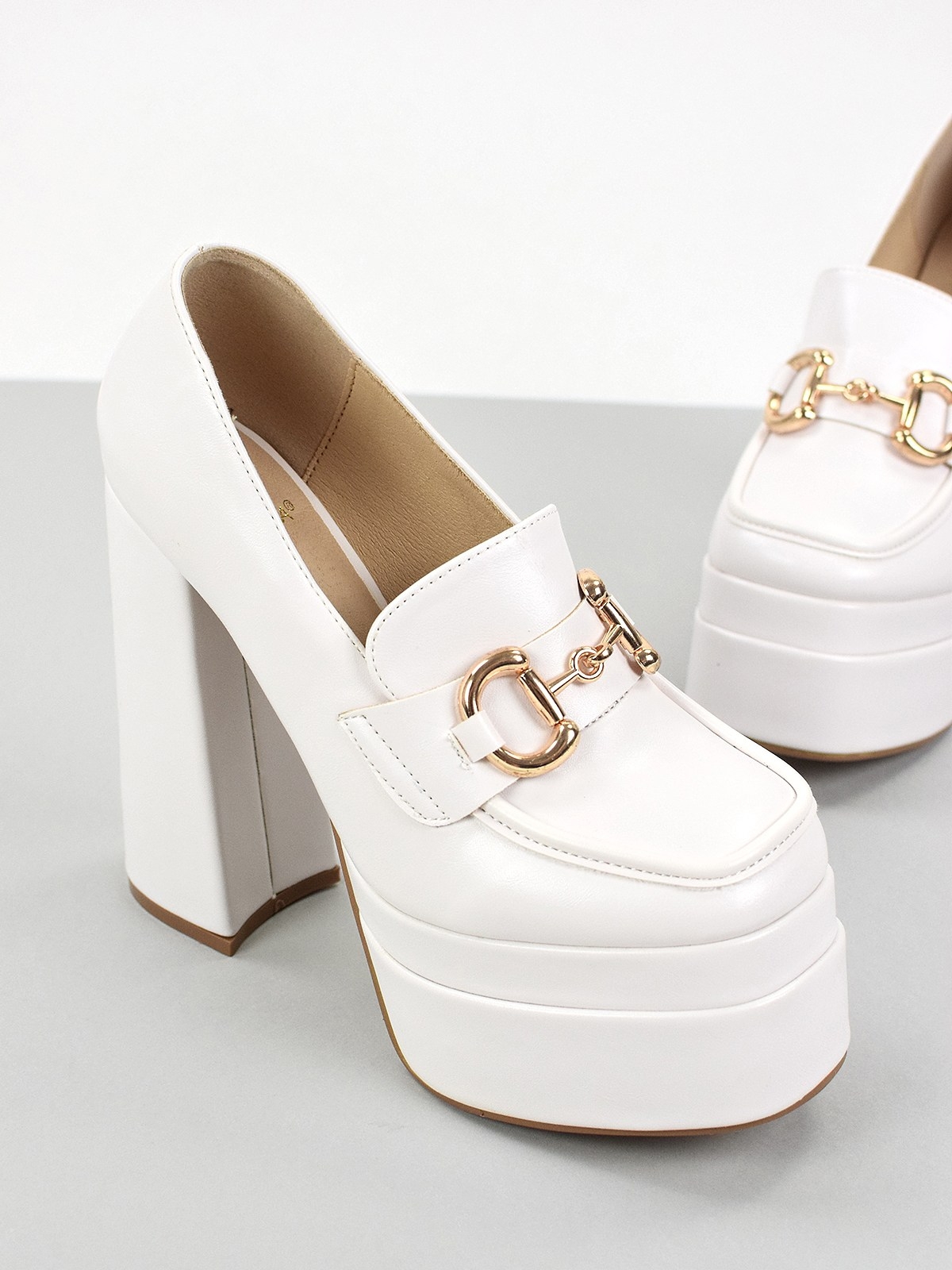 High heeled platform shoes with gold-tone metal trim in white