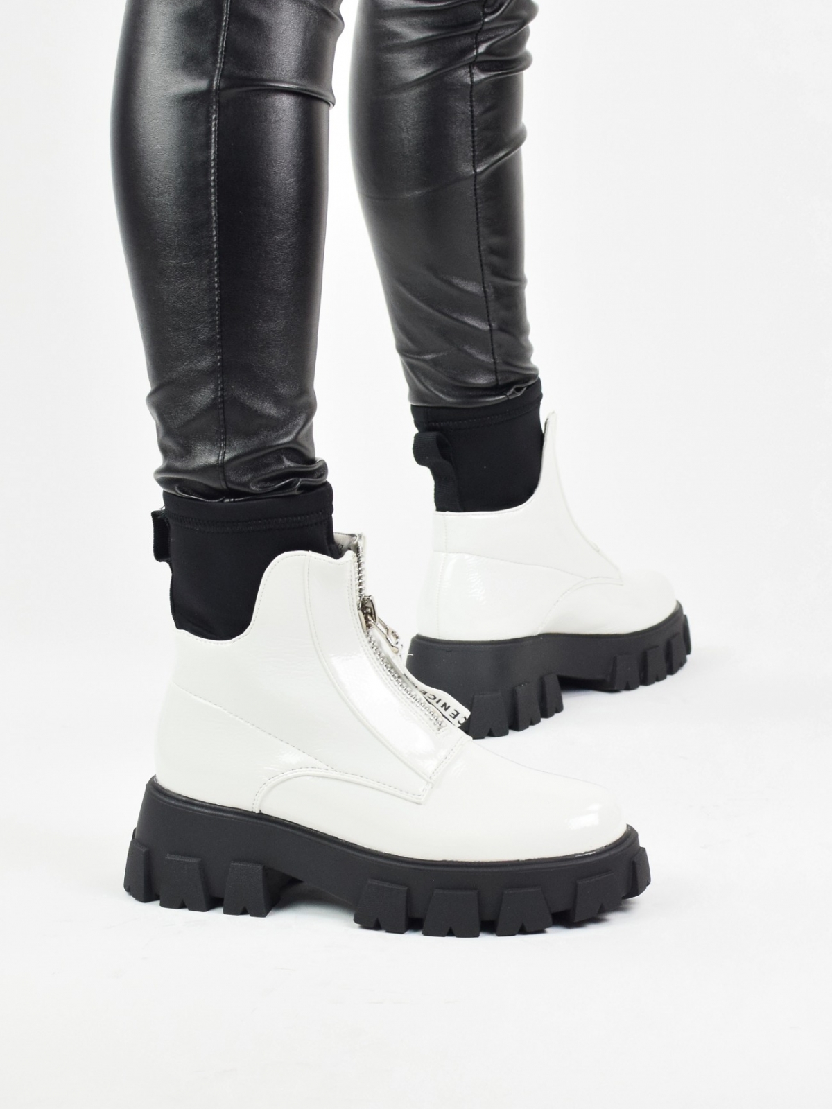 Exclusive ankle boots with front zipper in white