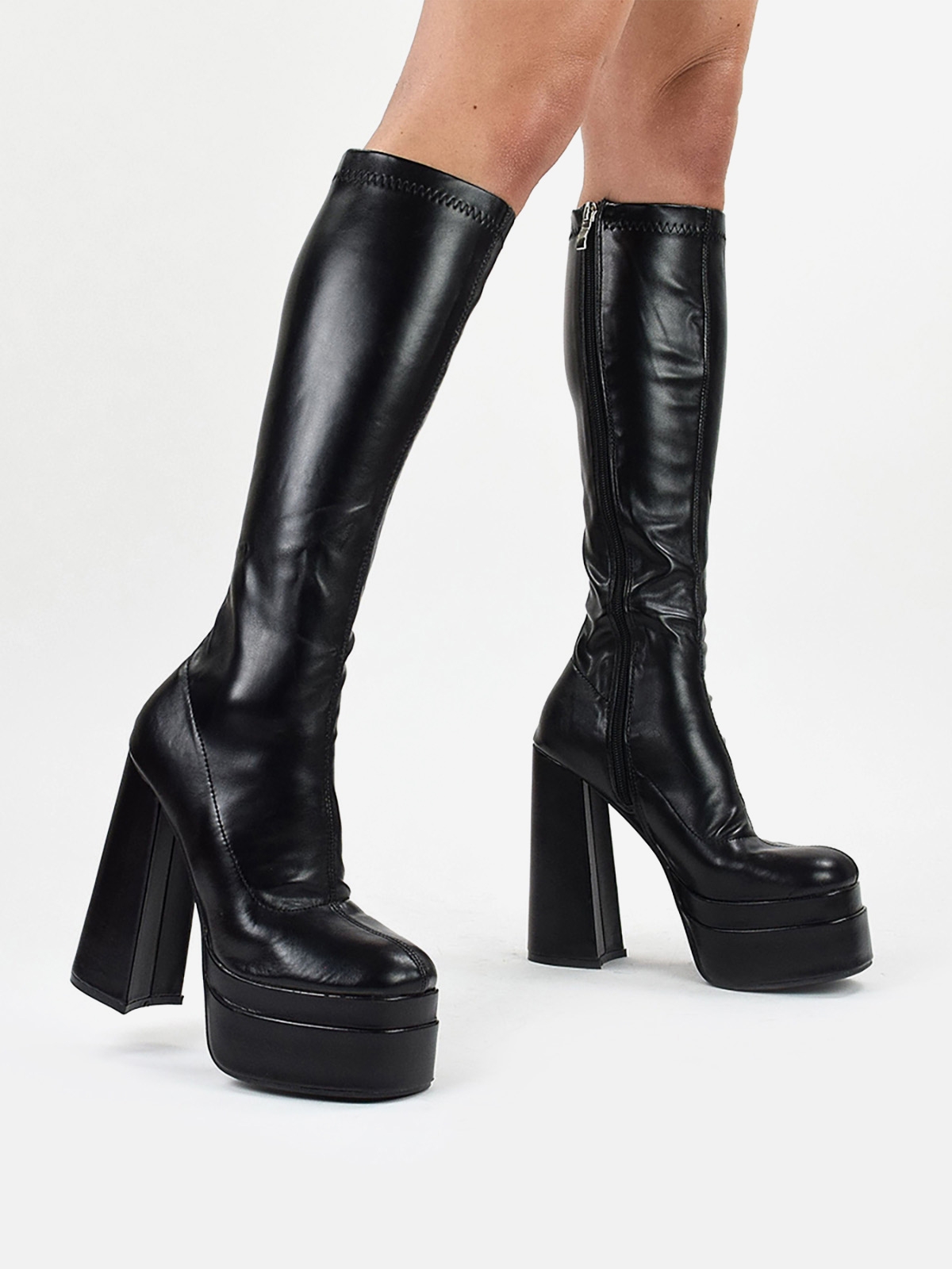 Women's platformed high heeled boots in black