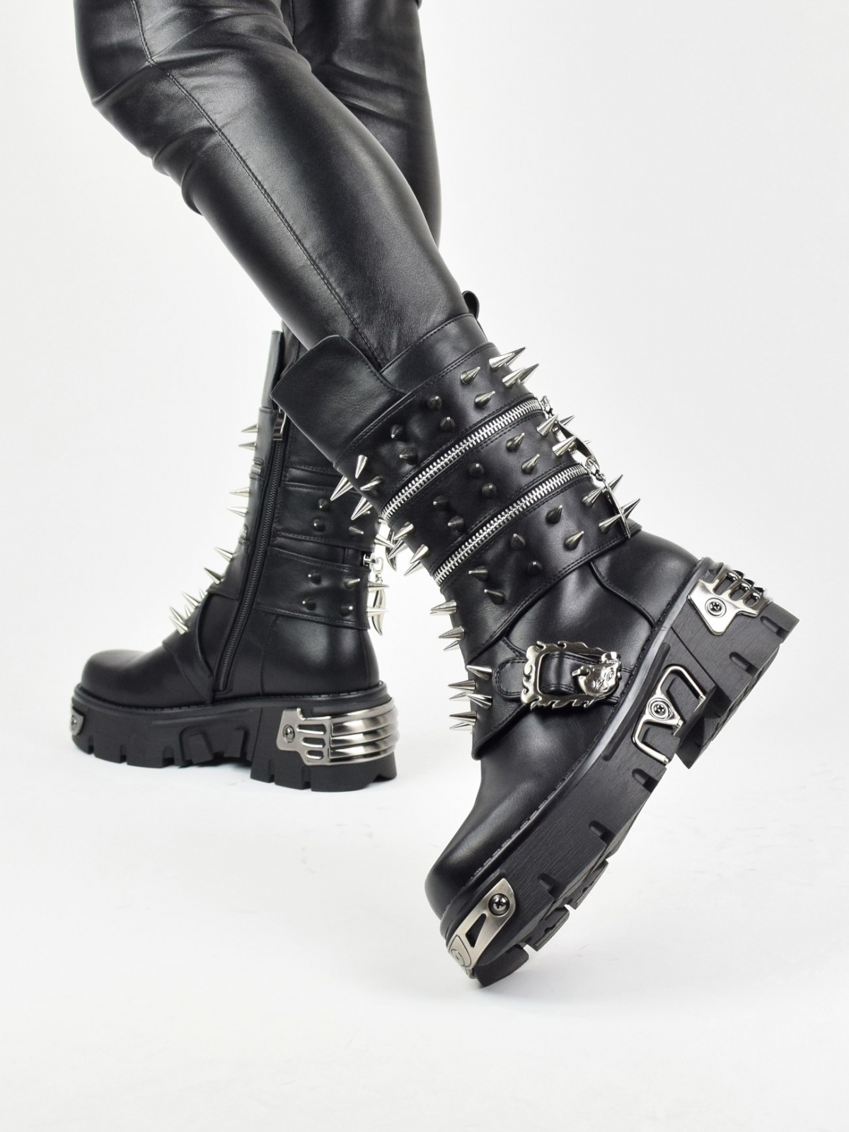 Cyberpunk style ankle boots with metal details in black