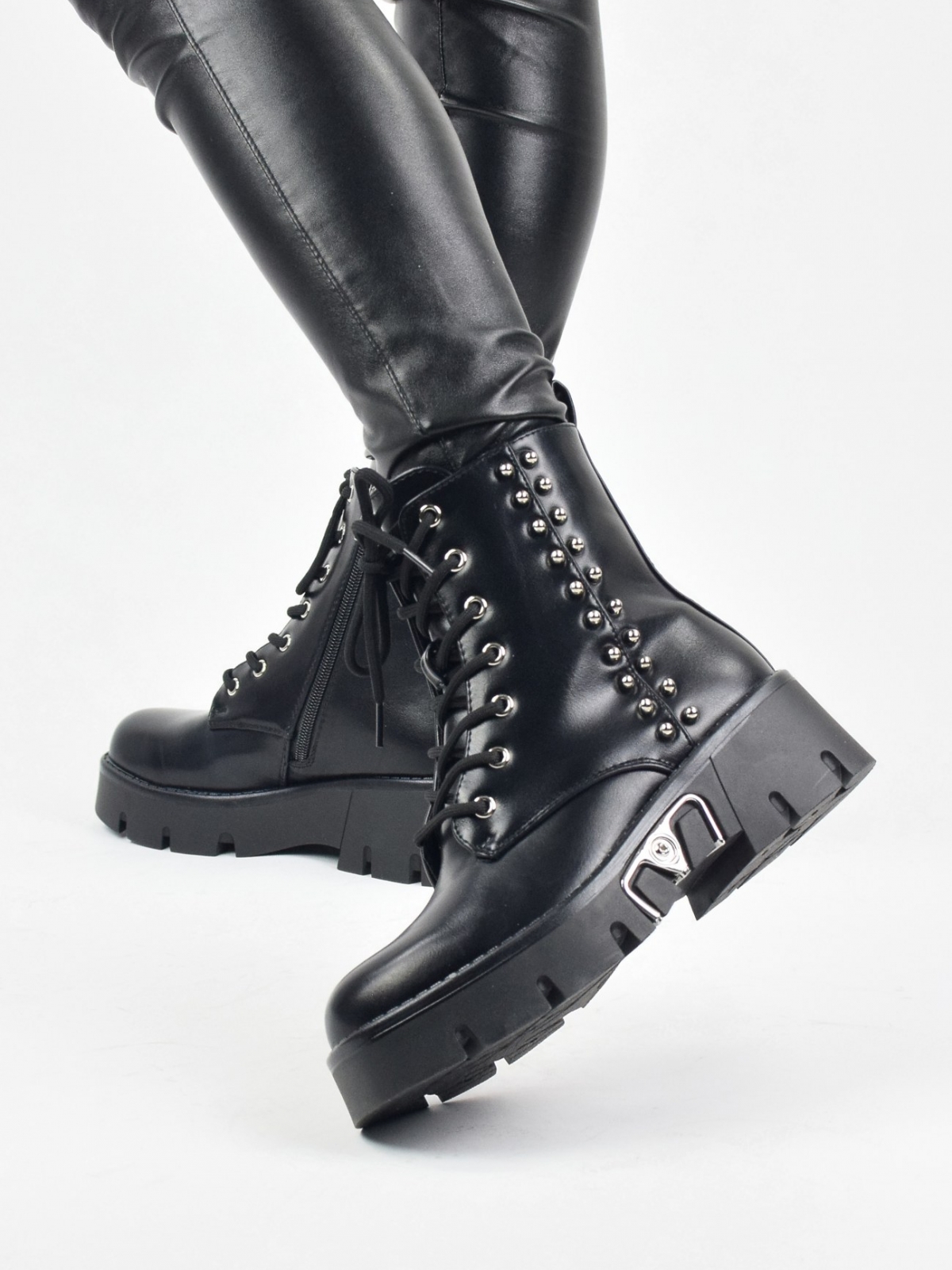 Original design ankle boots with metal details in black
