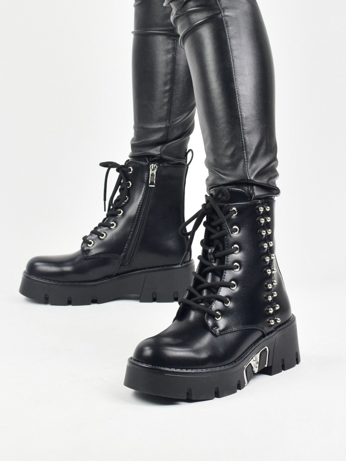 Original design ankle boots with metal details in black