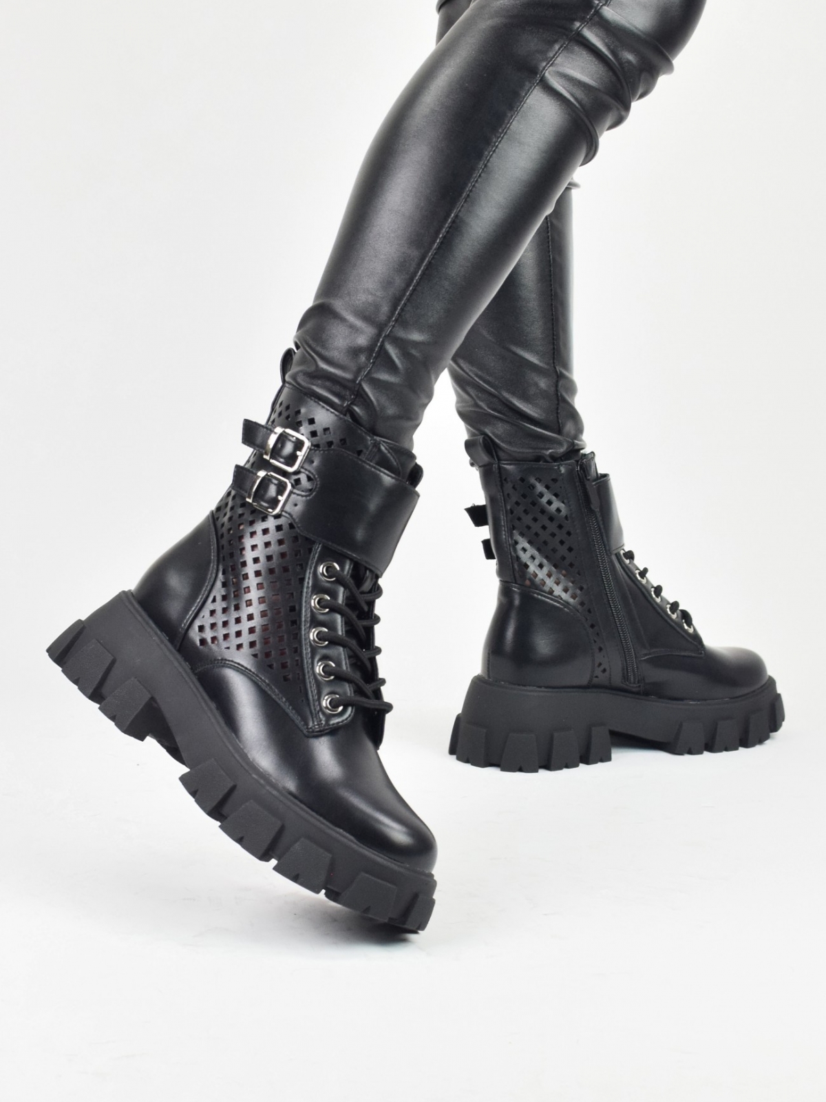 Thick sole holed ankle boots with straps & zipper in black