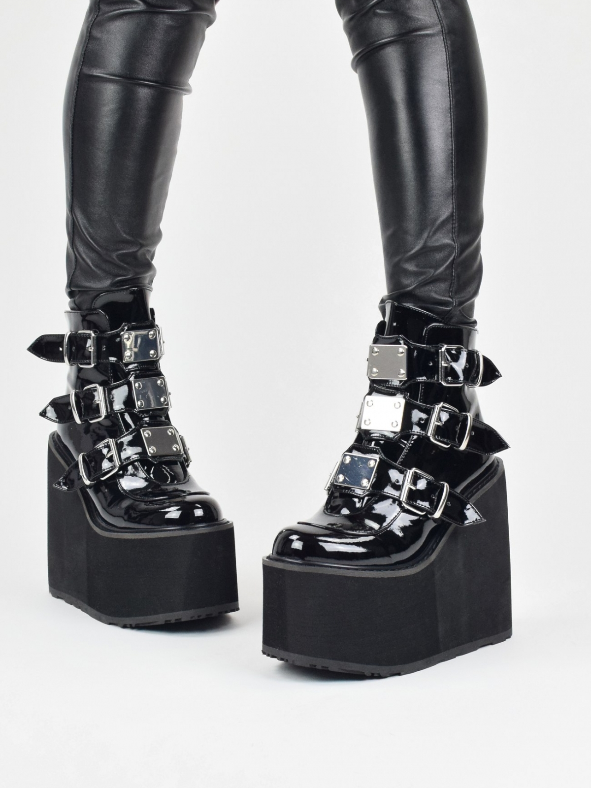Demonia Swing 105 high wedge platform ankle boots in black